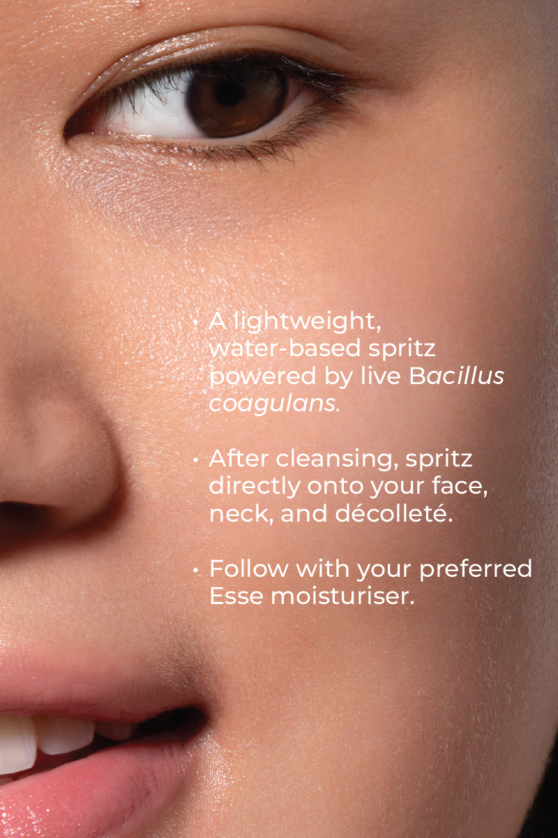 Close-up of a woman’s face with smooth skin, highlighting her eye, nose, and lips. Text overlays describe how to use Live Probiotic Mist—a lightweight, water-based facial spritz with Bacillus coagulans.
