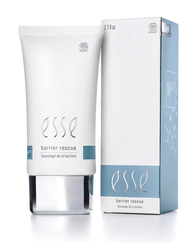 A white tube labeled “Esse Barrier Rescue” stands beside its matching blue and white box packaging on a white background, both featuring the Esse logo and product name in clean, modern fonts.